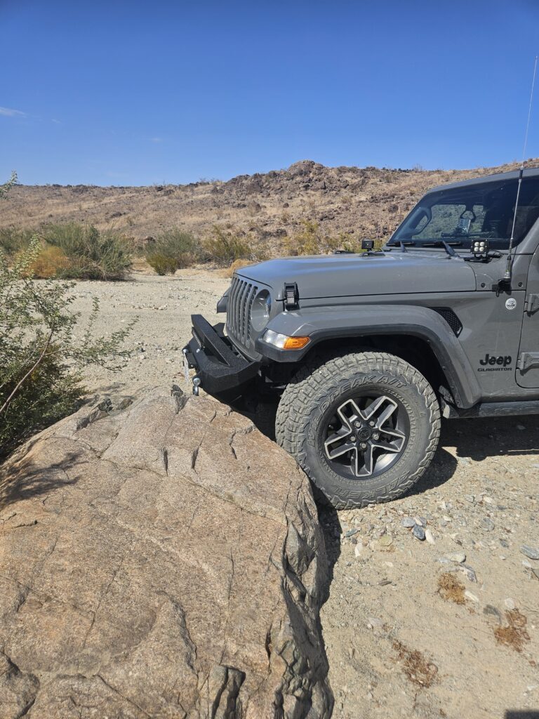 Hooke Road Rock Crawler Stubby Front Bumper installed on Jeep Gladiator on rock trail
